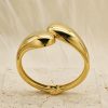 Geometric, glossy cross stainless steel bangle with asymmetric droplet double-headed design in INS style. - 图片 3
